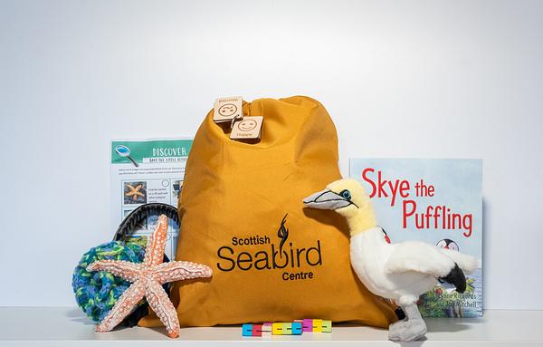 A bright bag with marine-themed sensory items.